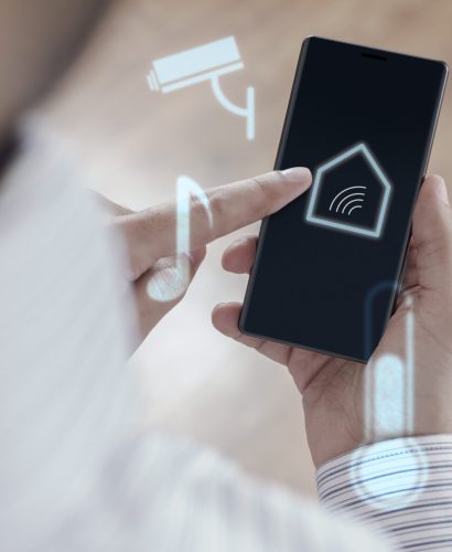 Man using smartphone to control Smart home - Smart house concept